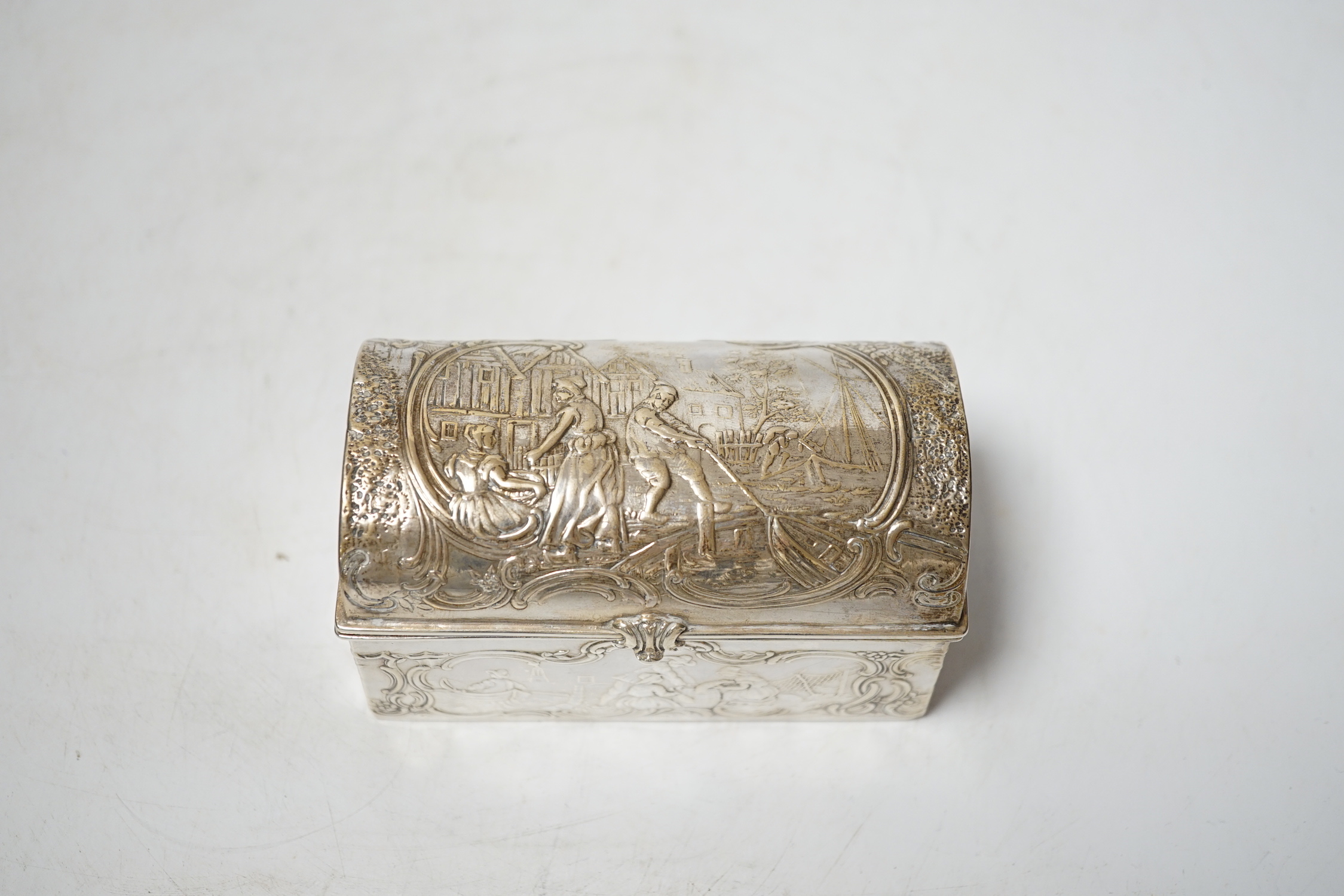 An early 20th century repousse Hanau silver box, modelled as a travelling trunk, import marks for Berthold Muller, Chester, 1903, width, 10cm.